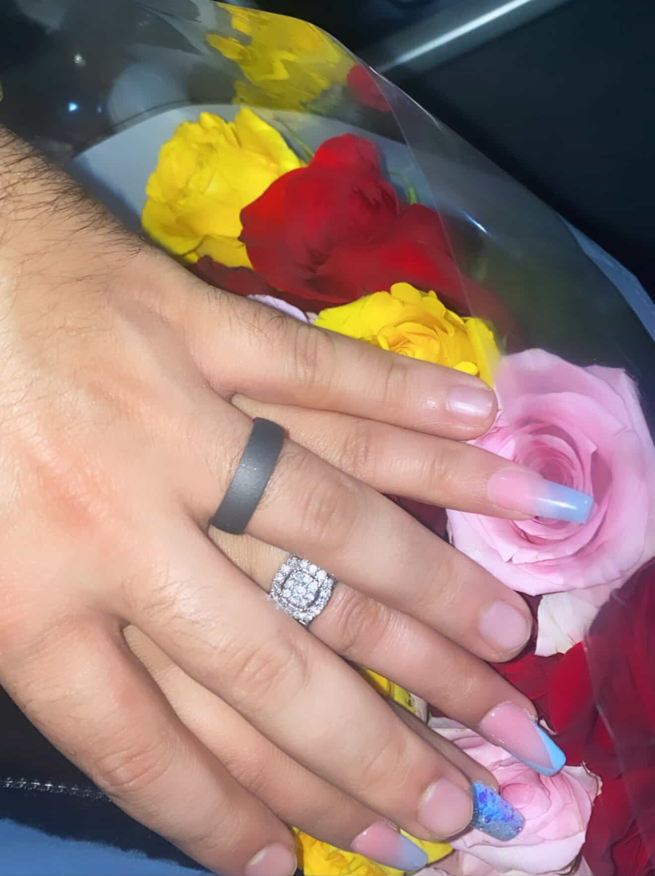 Amro & Fatima holding hands with rings